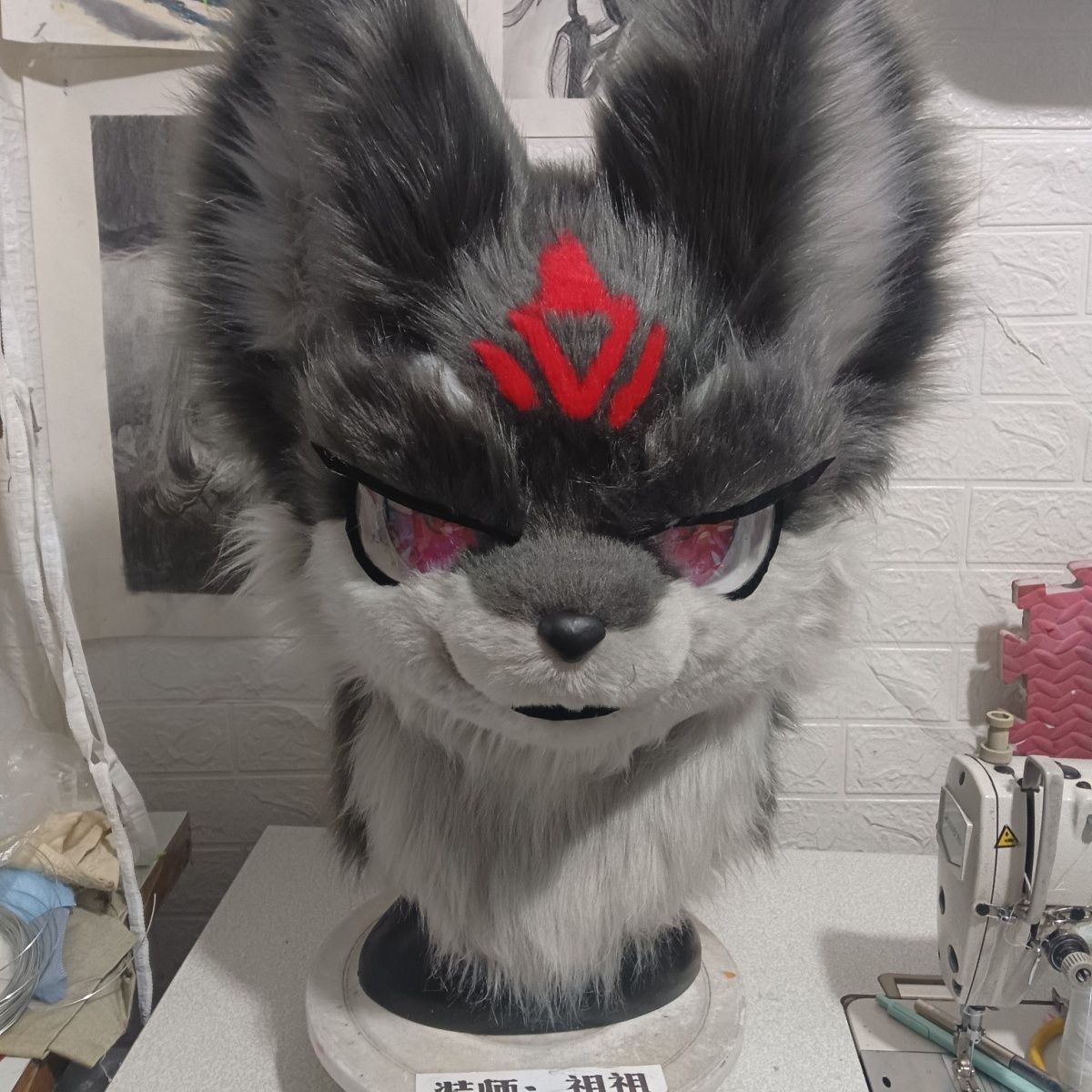 Furry head with half-covered eyelids