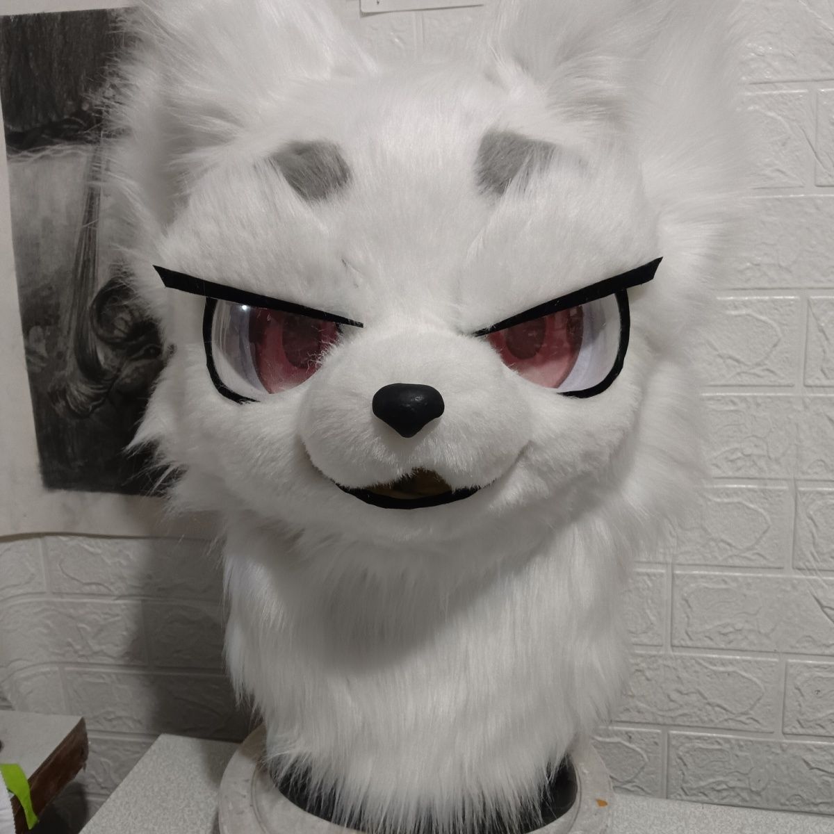 Furry head with half-covered eyelids