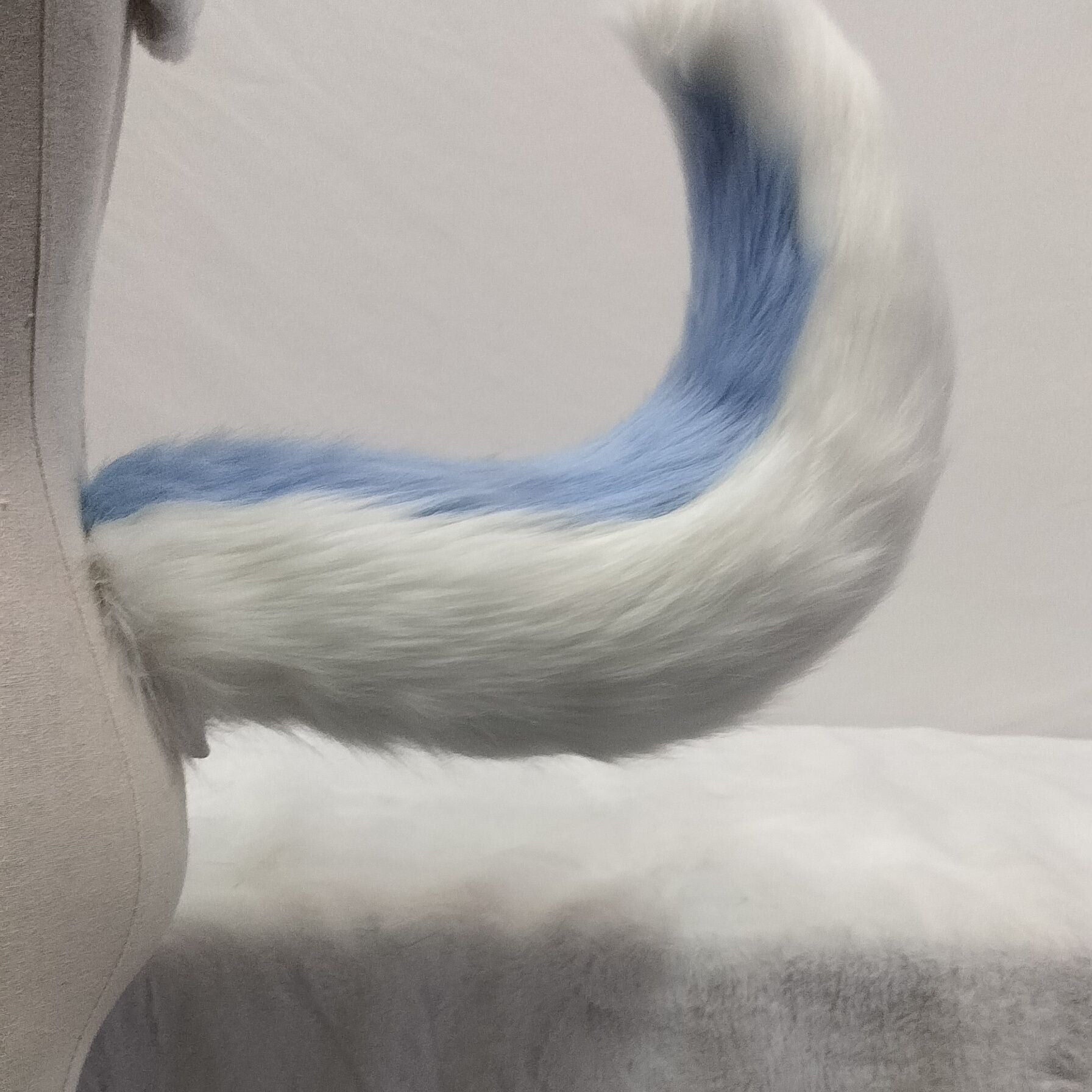 Pink and white tail simulation animal tail