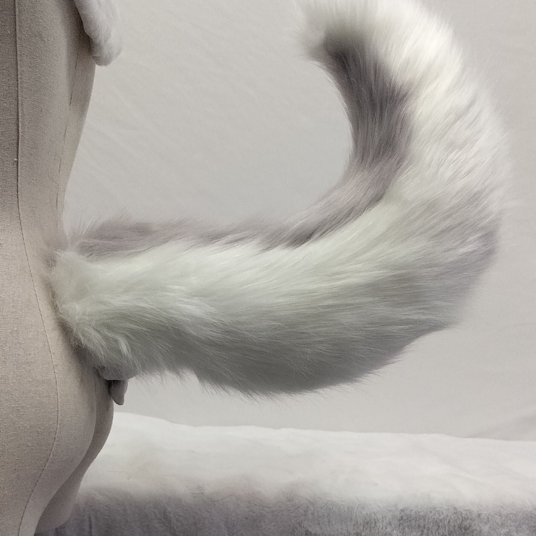 Pink and white tail simulation animal tail